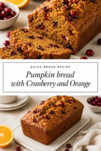 A sliced loaf of moist pumpkin bread studded with red cranberries, served on a plate with orange slice garnishes.